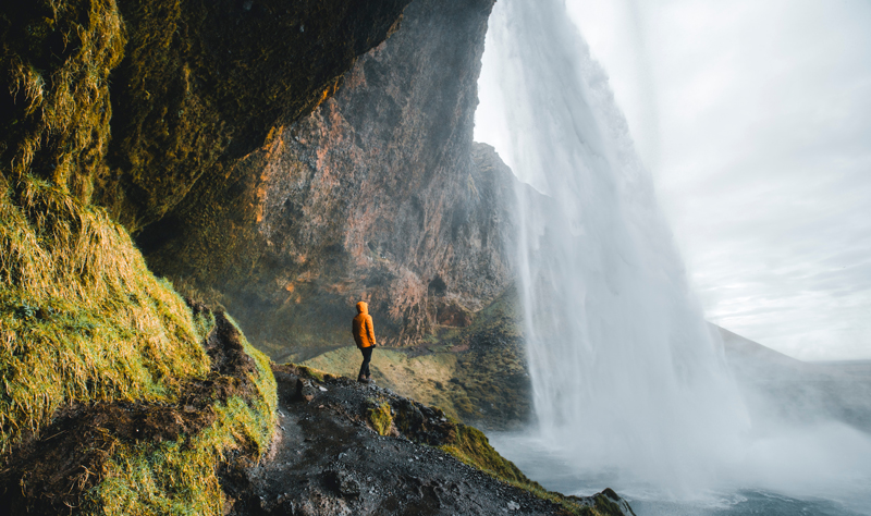 Exploring a waterfall on a geography field trip