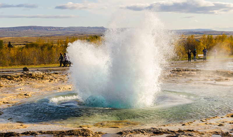 An erupting geyser on a geography field trip to Iceland