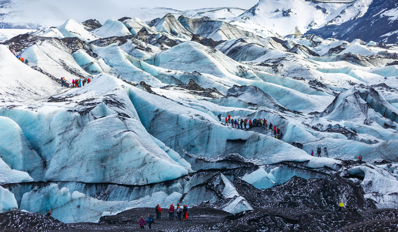 Visiting the Solheimajokull glacier on a geography field trip to Iceland