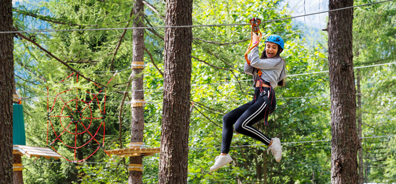 A student on a high ropes activity on a school trip to France